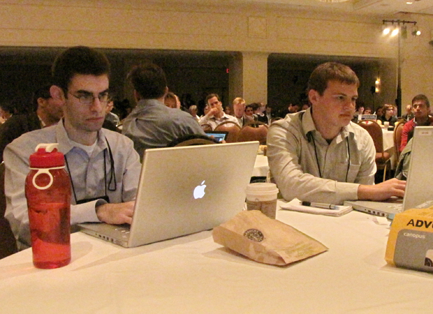 Greg Linch, left, and McKenna Ewen help with the live streams at Friday morning's keynote panel. Photo by Ethan Klapper.